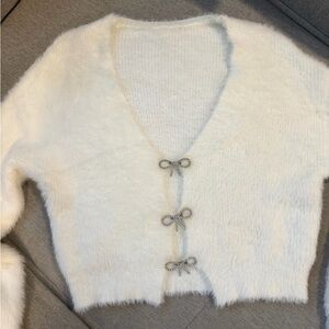 Fuzzy White V-Neck Cardigan with Bow Accent Closures